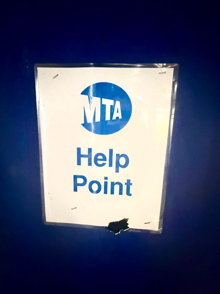 MTA Help Point sign displayed on a blue background.